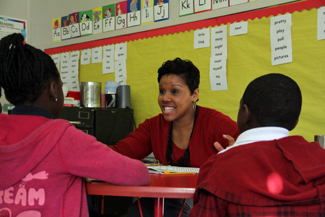 Kristen Wells works with a small group of students in Terrol McElroy’s classroom at Emmalee Isable Elementary in Jackson while McElroy observes. (Photo: Jackie Mader)